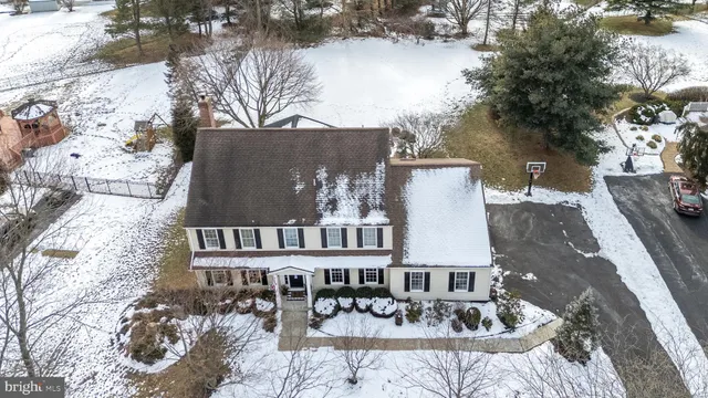 a view of the house with backyard and sitting area