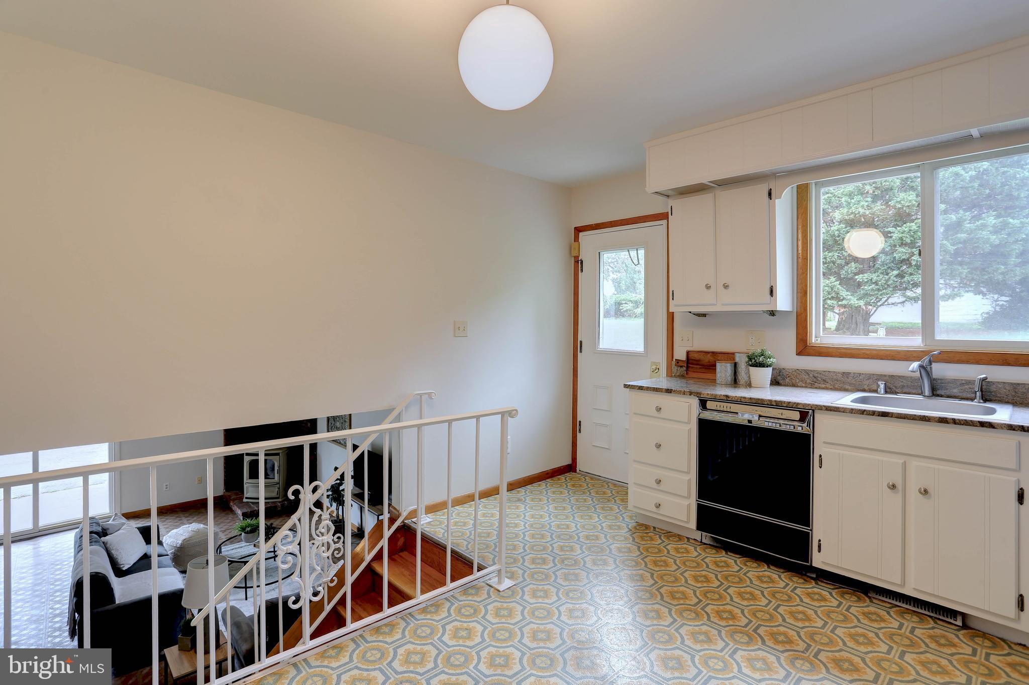 8453 Rolling Ridge Court Ellicott City, MD 21043 - Photo 12 of 39 Kitchen with exit to patio & stairs to lower level