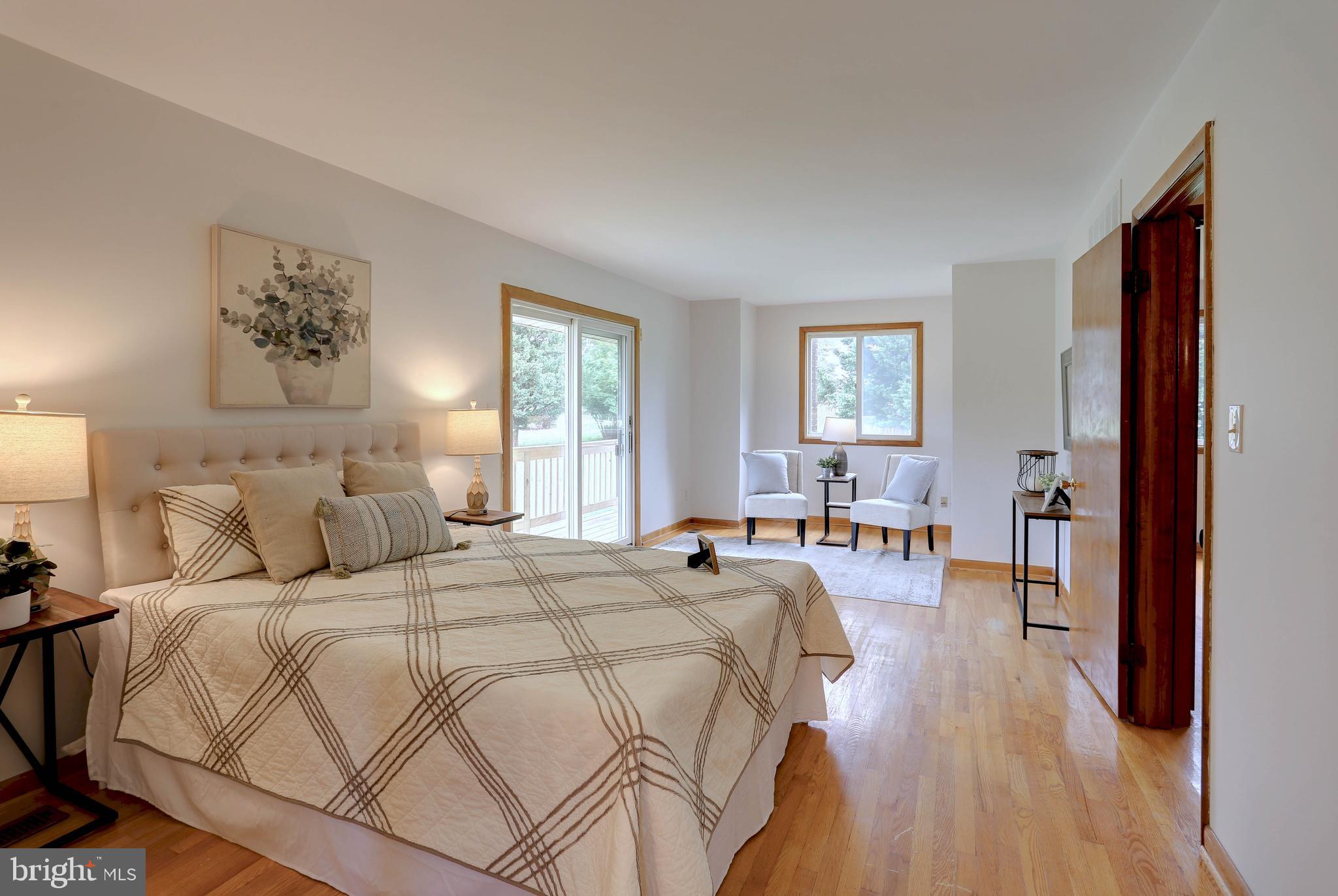 8453 Rolling Ridge Court Ellicott City, MD 21043 - Photo 15 of 39 Primary Bdrm w/ hardwoods,full bath & balcony