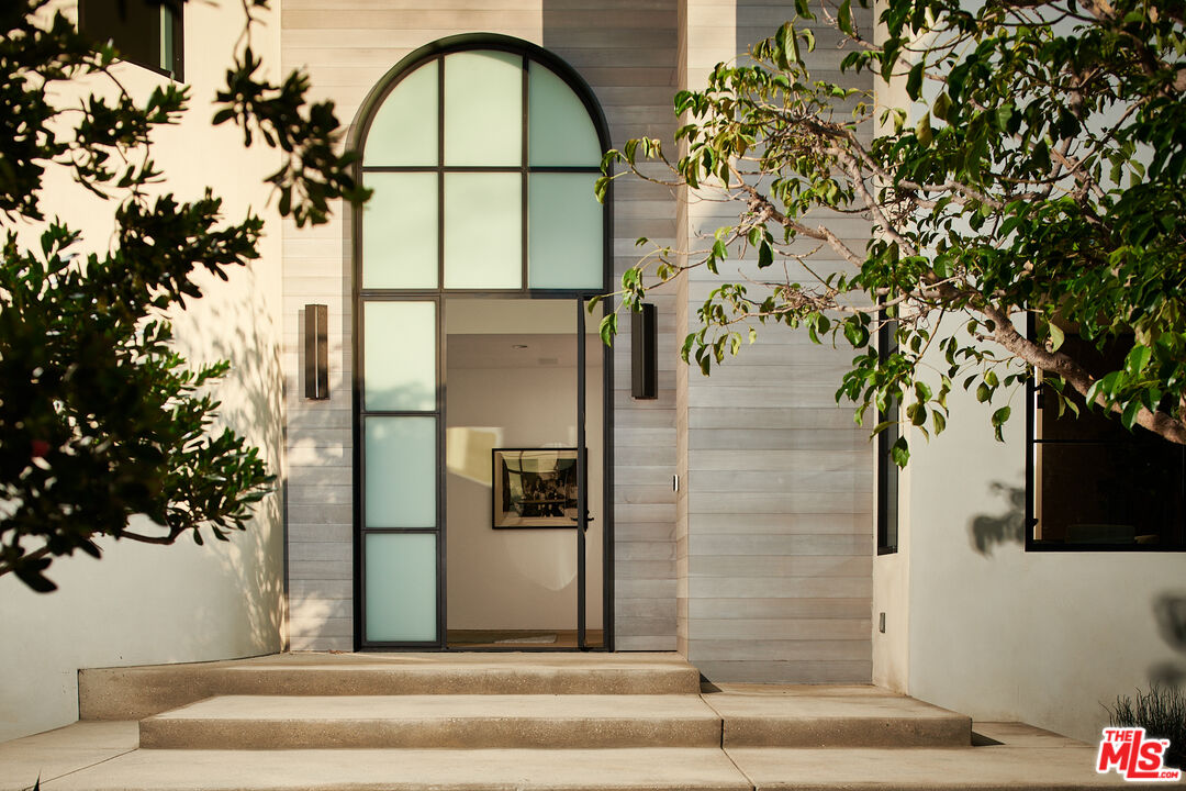 3858 Hayvenhurst Drive Encino, CA 91436 - Photo 3 of 49 a view of entrance gate of the house