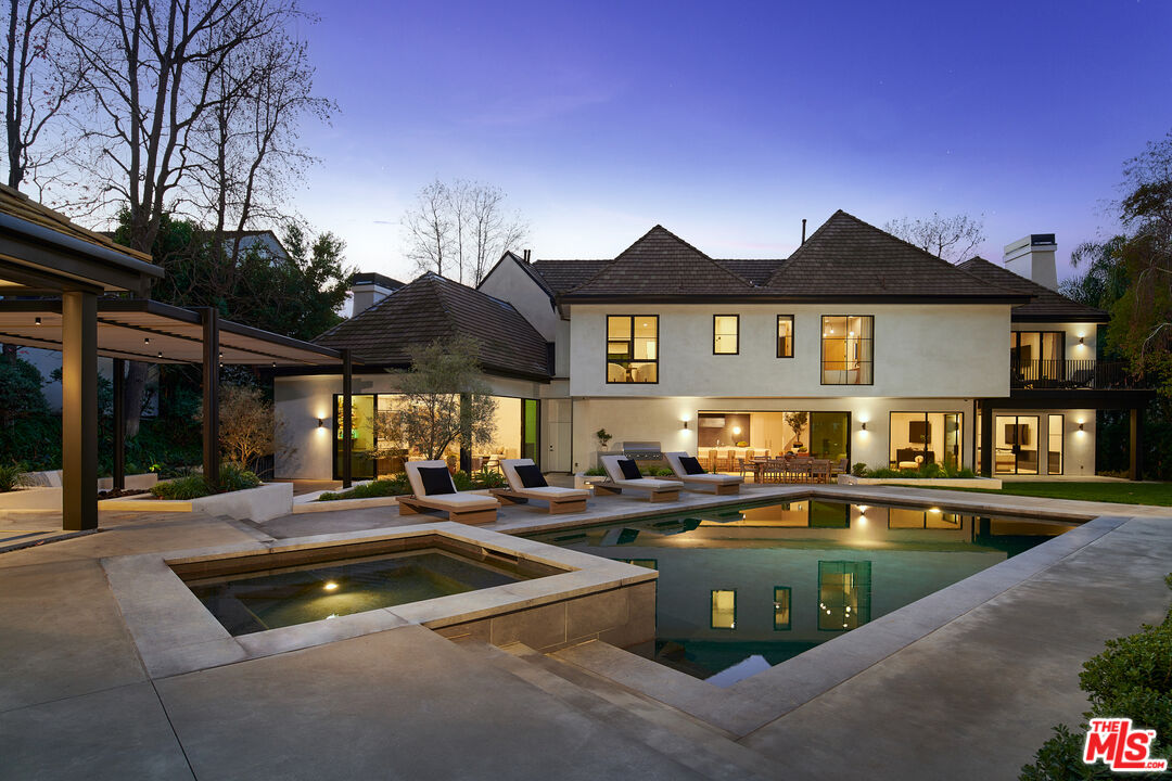 3858 Hayvenhurst Drive Encino, CA 91436 - Photo 37 of 49 a view of a patio with swimming pool table and chairs