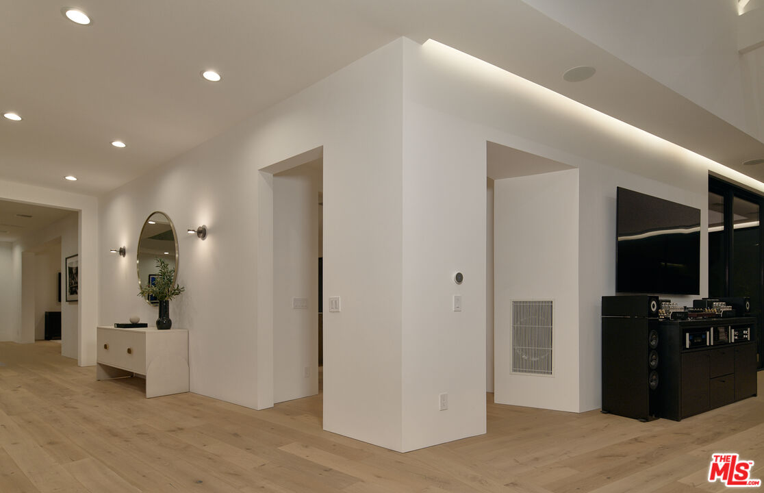 3858 Hayvenhurst Drive Encino, CA 91436 - Photo 44 of 49 a view of hallway with wooden floor
