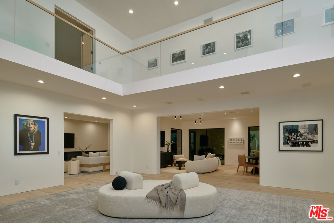 3858 Hayvenhurst Drive Encino, CA 91436 - Photo 45 of 49 a living room with furniture and a large window