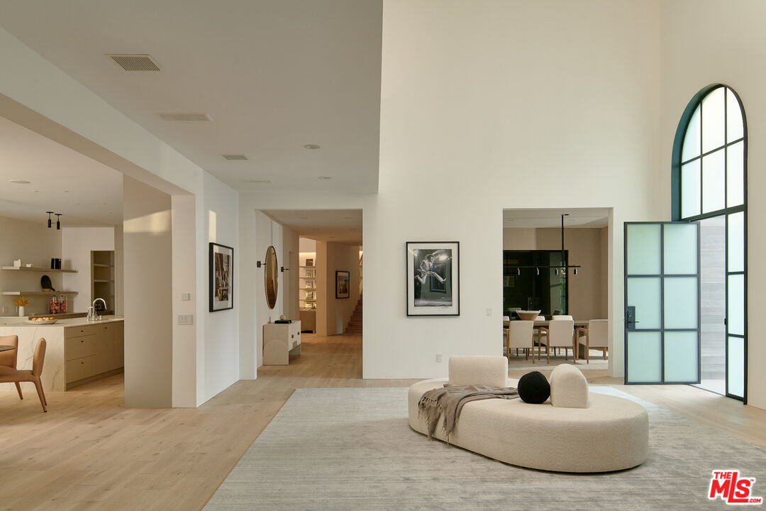3858 Hayvenhurst Drive Encino, CA 91436 - Photo 9 of 49 a living room with furniture and a flat screen tv