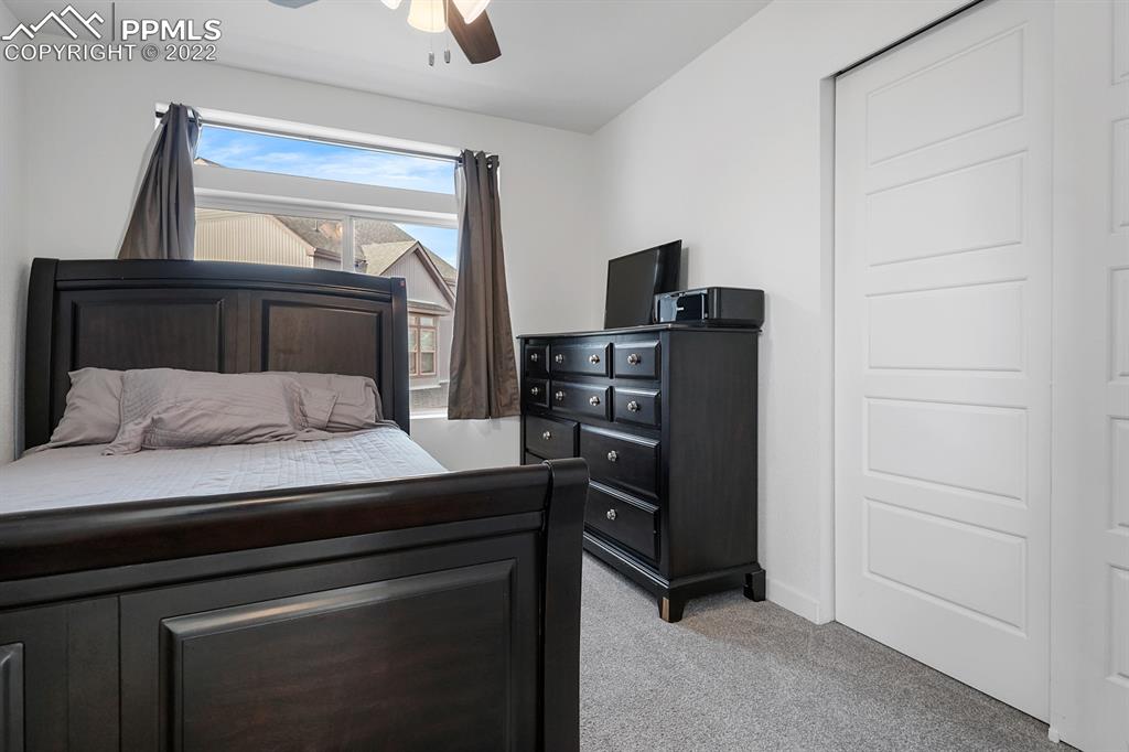 9319 Timberlake Loop Colorado Springs, CO 80927 - Photo 17 of 25 a bedroom with a bed and tv