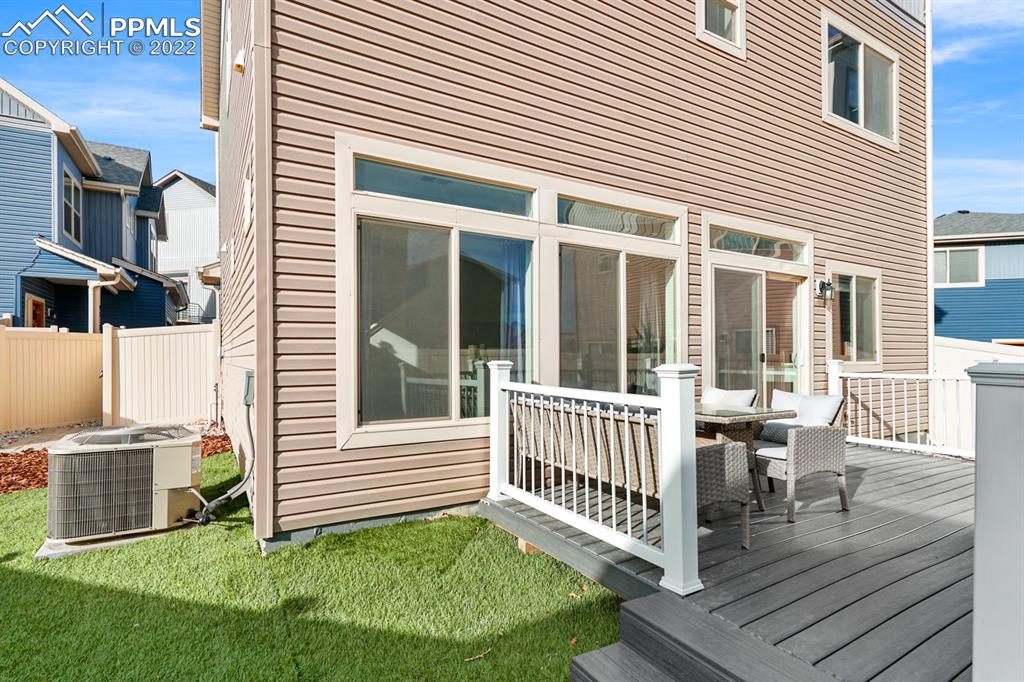 9319 Timberlake Loop Colorado Springs, CO 80927 - Photo 24 of 25 a view of a house with a yard and deck