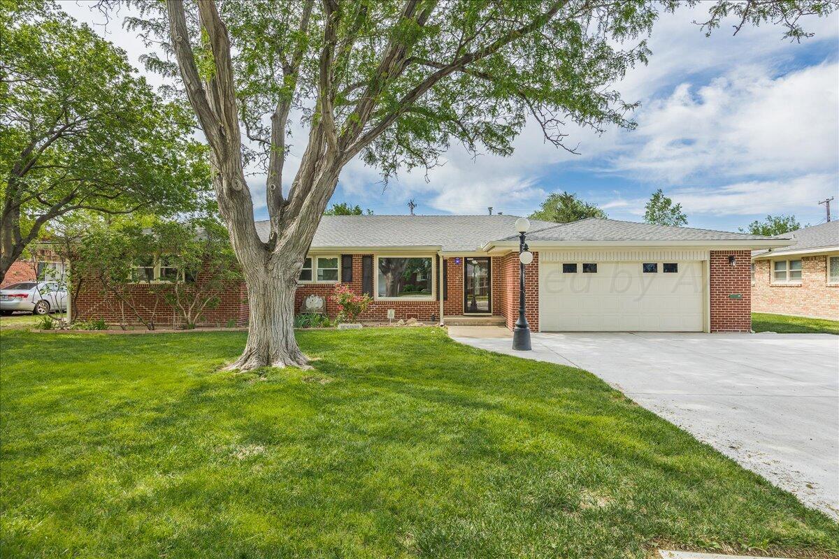 front view of a house with a yard