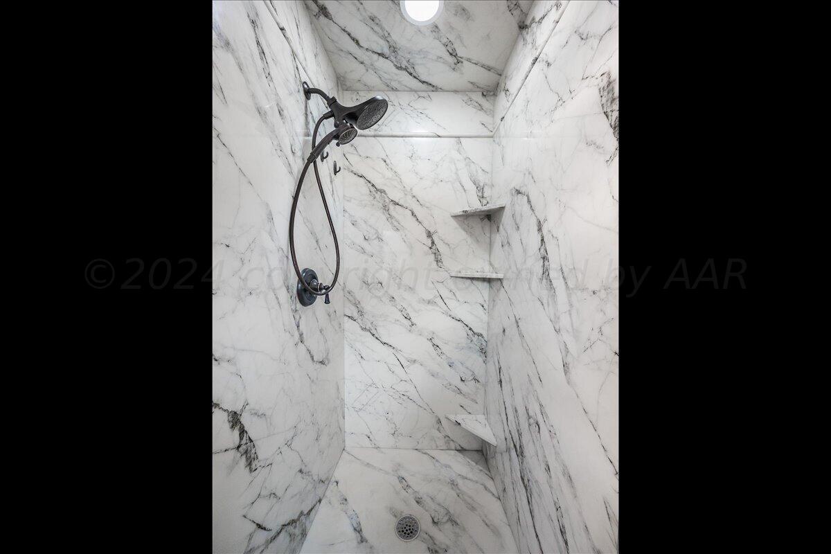 3017 Mockingbird Lane Amarillo, TX 79109 - Photo 17 of 25 a picture of a bathroom with a shower