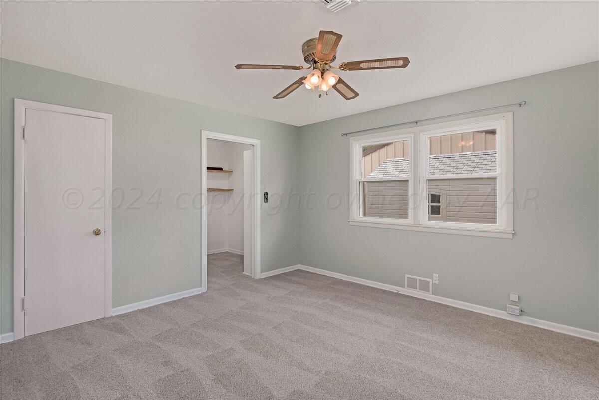3017 Mockingbird Lane Amarillo, TX 79109 - Photo 18 of 25 a view of an empty room with a window