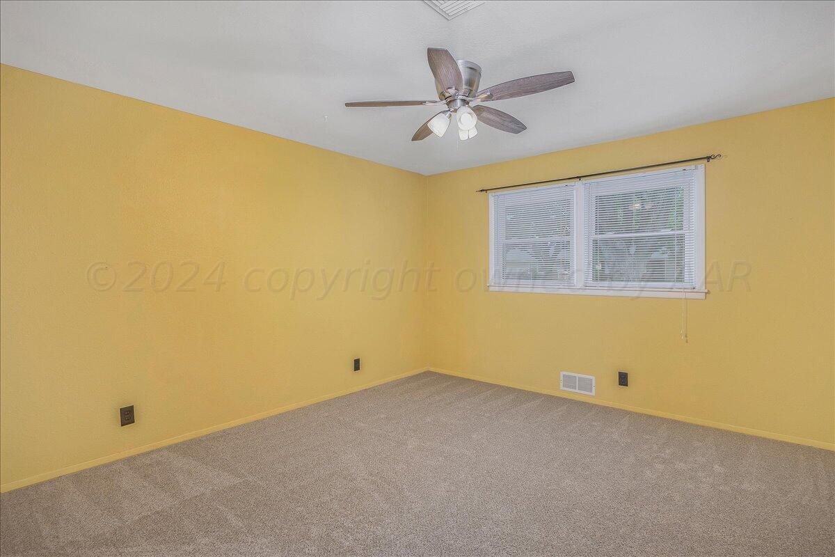 3017 Mockingbird Lane Amarillo, TX 79109 - Photo 21 of 25 a view of an empty room with a window