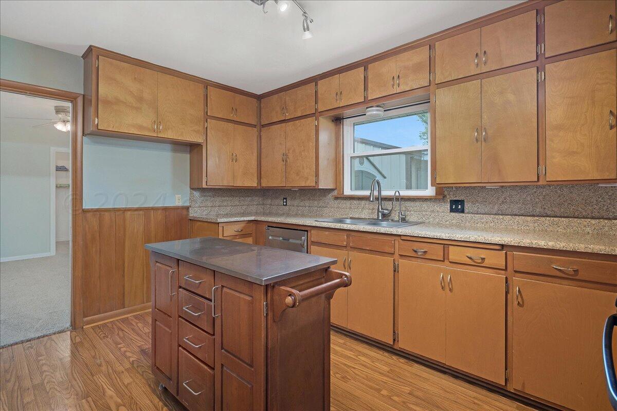3017 Mockingbird Lane Amarillo, TX 79109 - Photo 10 of 25 a kitchen with stainless steel appliances granite countertop a sink stove and cabinets