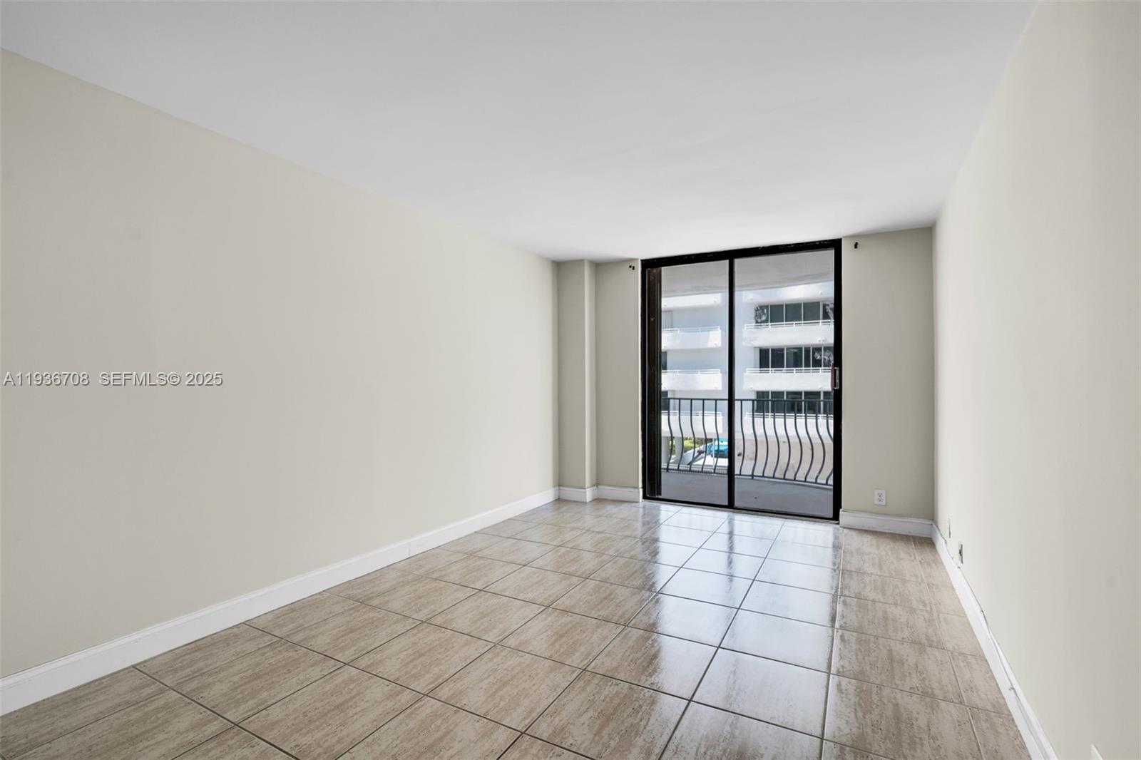 8877 Collins Avenue, Unit 303 Surfside, FL 33154 - Photo 18 of 25 a view of an empty room and window