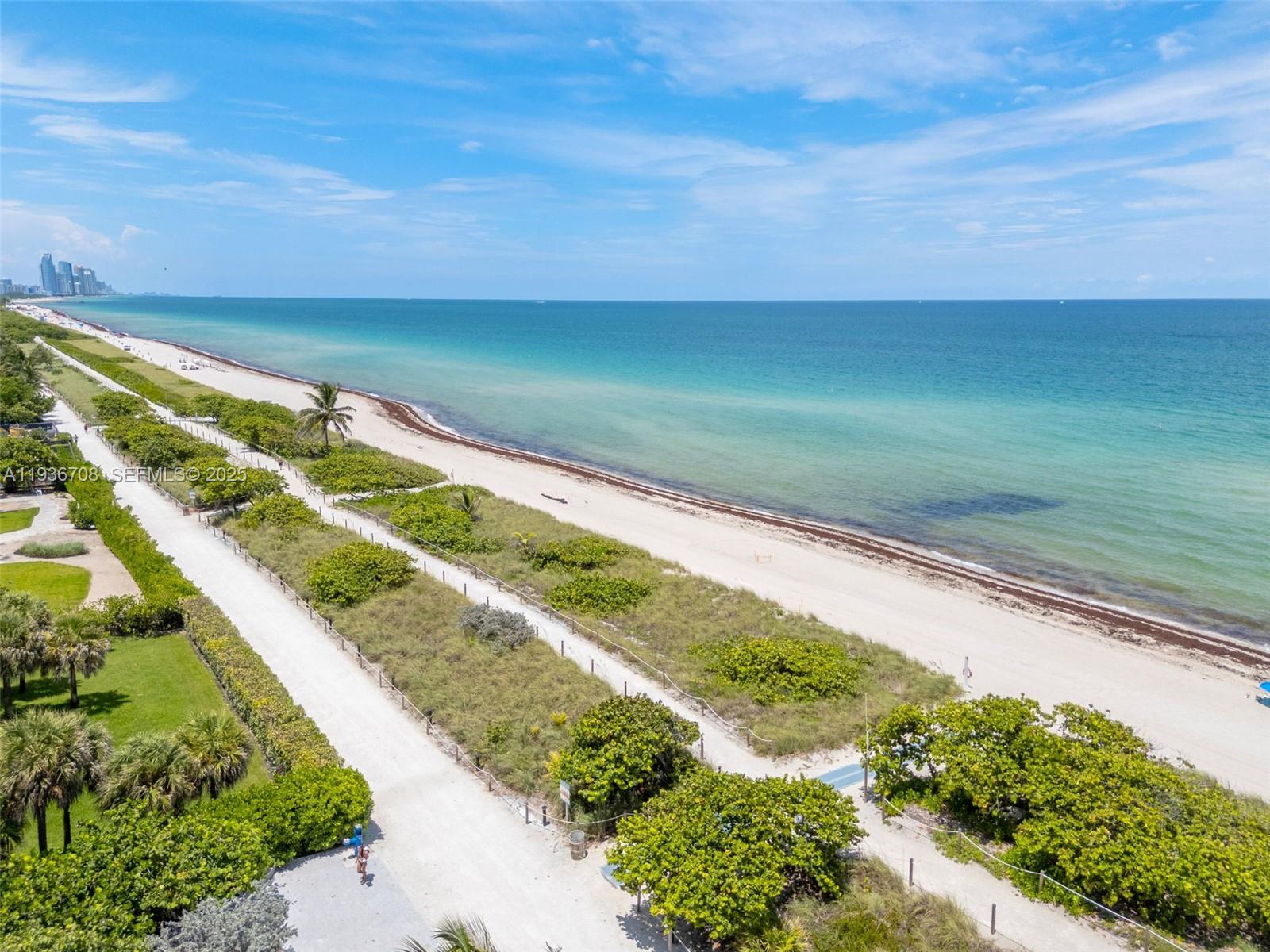 8877 Collins Avenue, Unit 303 Surfside, FL 33154 - Photo 25 of 25 a view of a yard with an ocean view