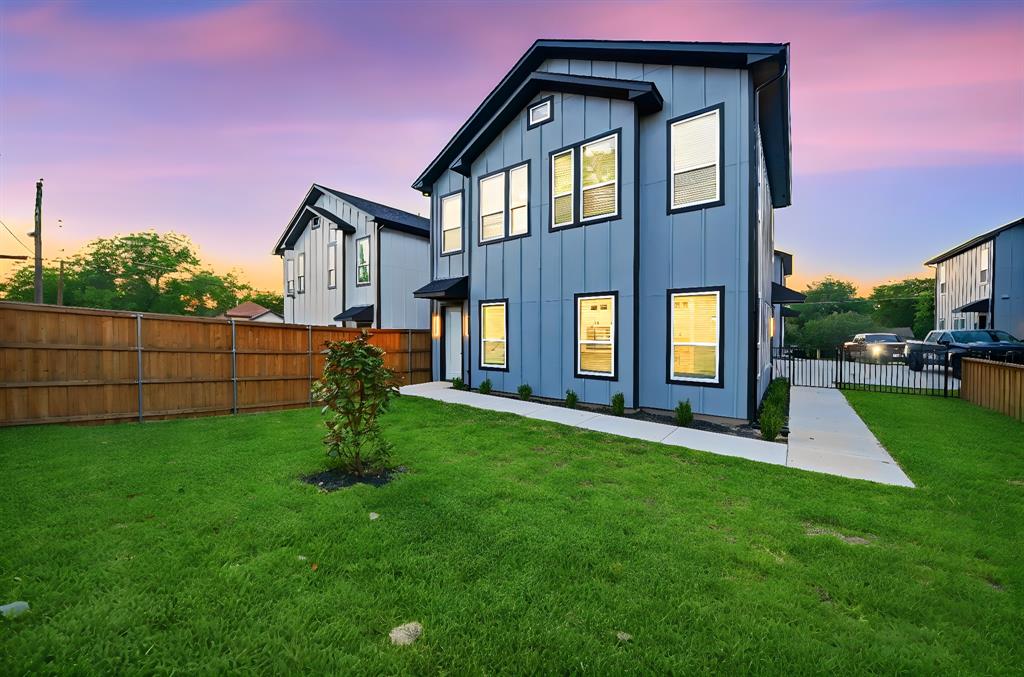 306 East 7th Street Dallas, TX 75203 - Photo 1 of 22 Modern two-story residence featuring a blue siding exterior with black trim windows