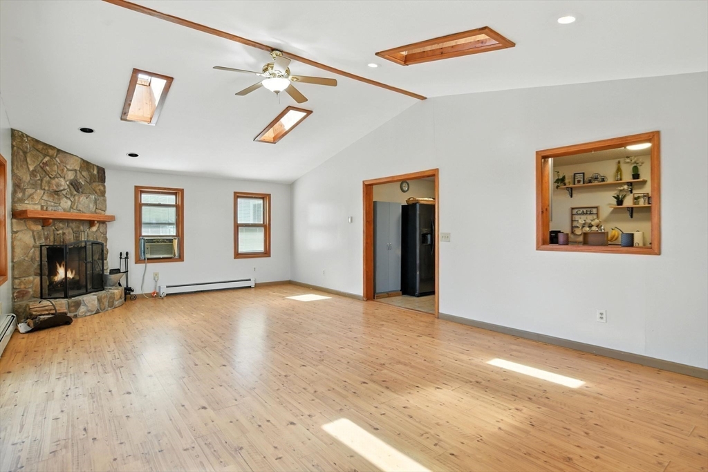 4 Dunhamtown Road Monson, MA 01069 - Photo 14 of 27 a view of an empty room with a fireplace and a window