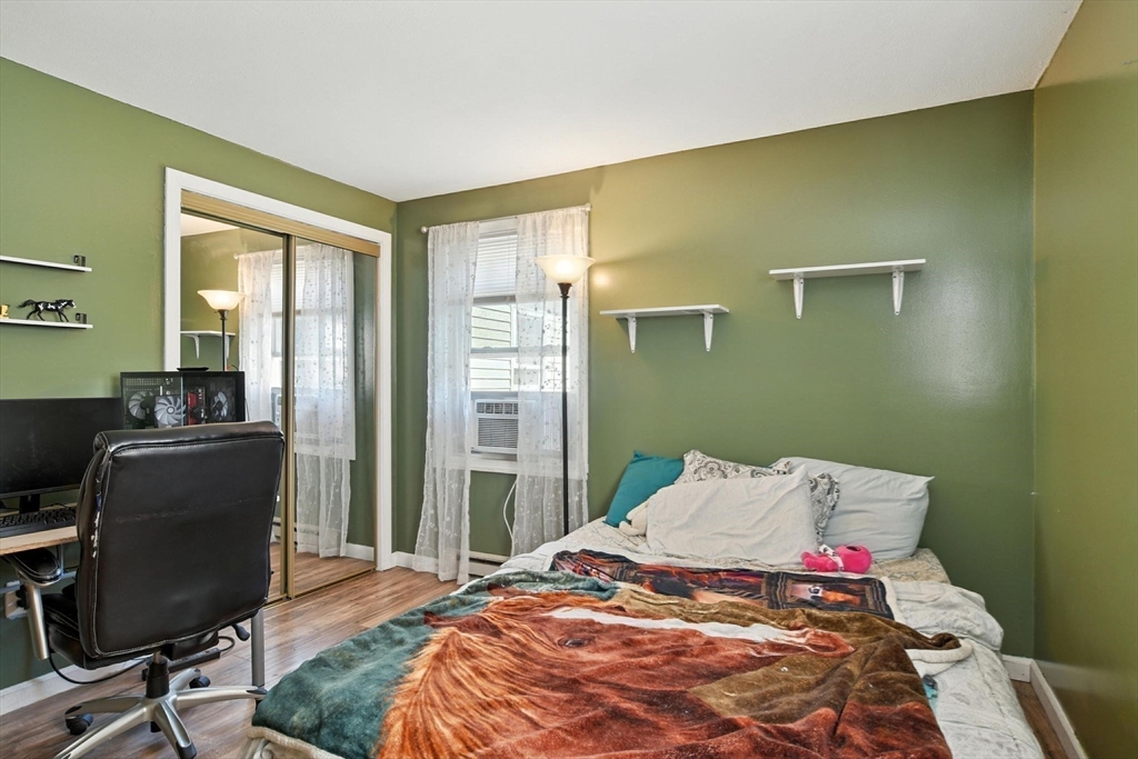 4 Dunhamtown Road Monson, MA 01069 - Photo 20 of 27 a bedroom with a bed and wooden floor
