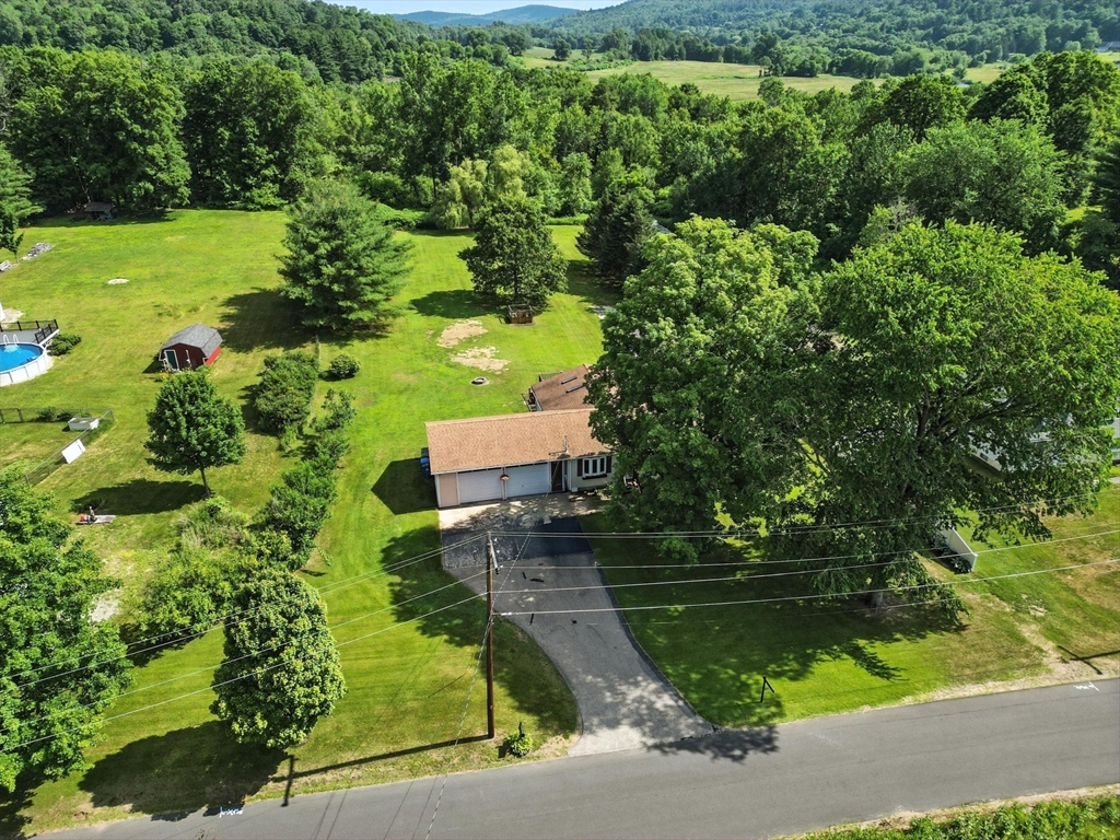 4 Dunhamtown Road Monson, MA 01069 - Photo 3 of 27 an aerial view of a house with a yard lake lake and outdoor seating