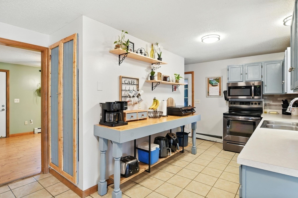4 Dunhamtown Road Monson, MA 01069 - Photo 5 of 27 a view of kitchen with cabinets and wooden floor