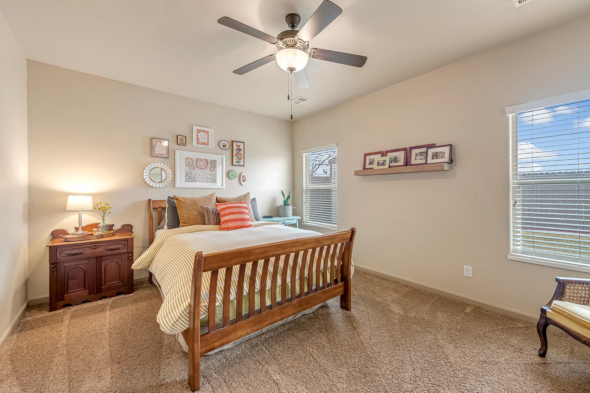 1660 Powis Lane Fruita, CO 81521 - Photo 13 of 38 a bedroom with a bed and a chandelier