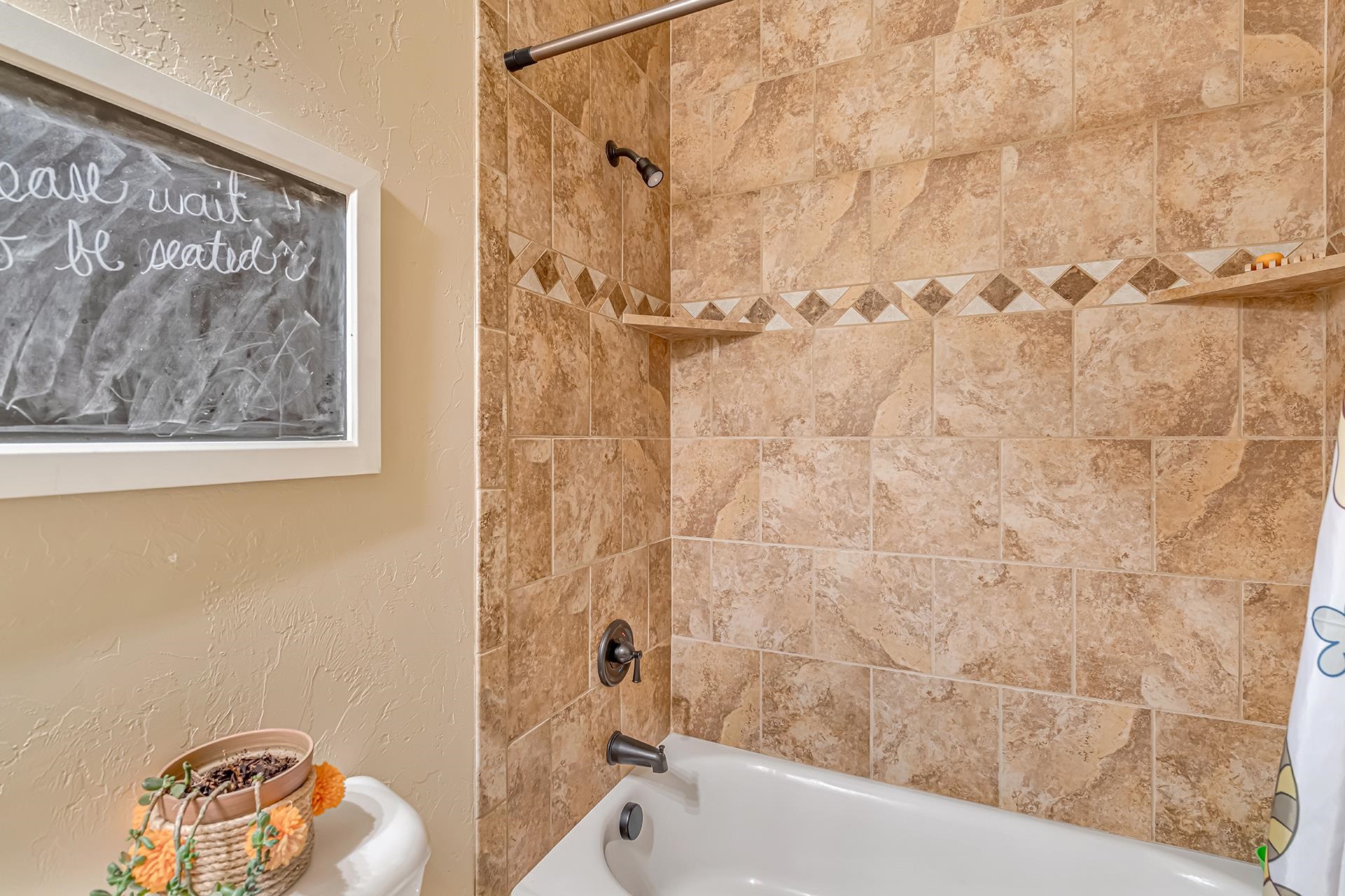 1660 Powis Lane Fruita, CO 81521 - Photo 19 of 38 a bathroom with a bathtub and shower