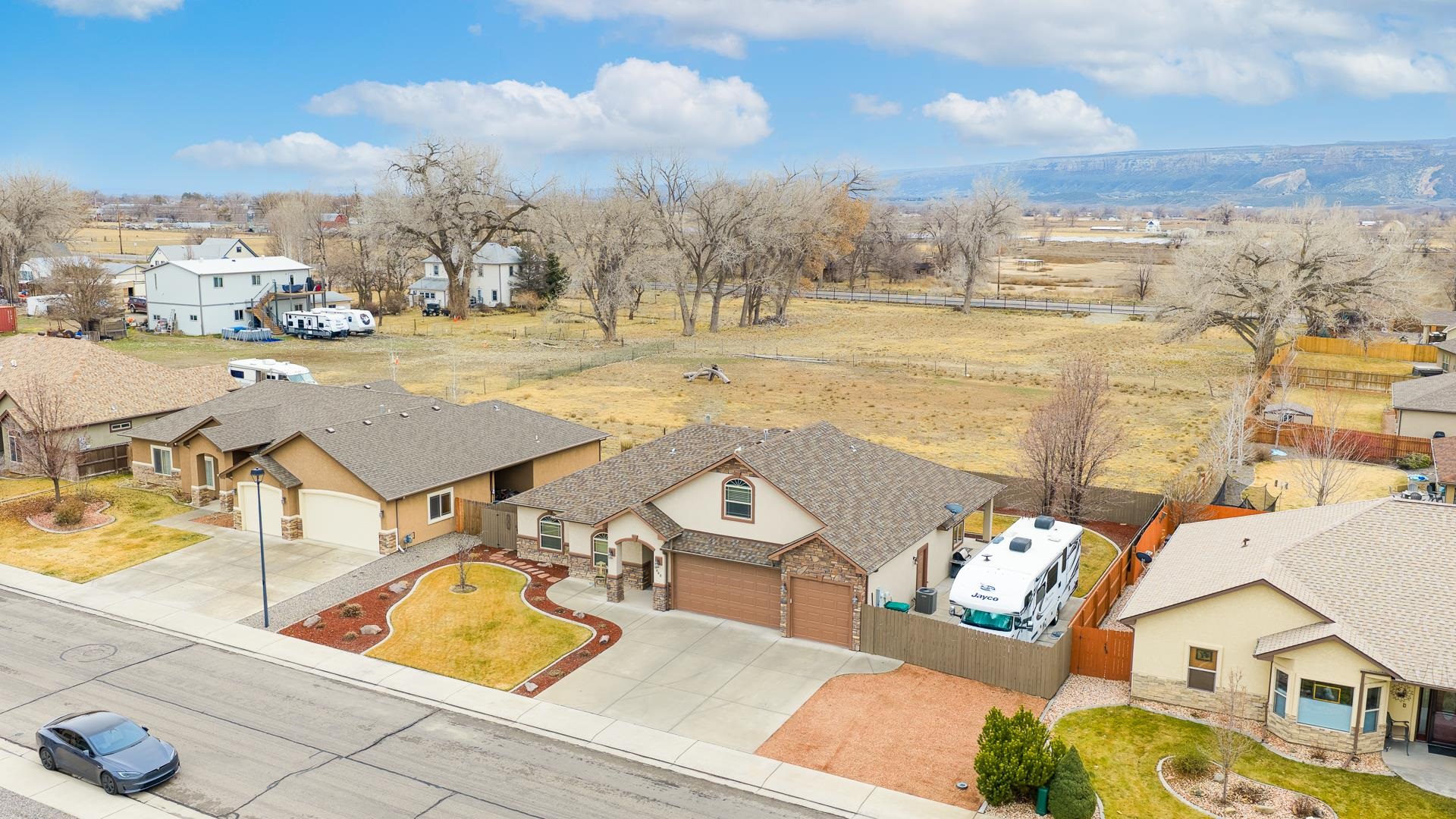 1660 Powis Lane Fruita, CO 81521 - Photo 28 of 38 a view of a terrace with chairs and a table