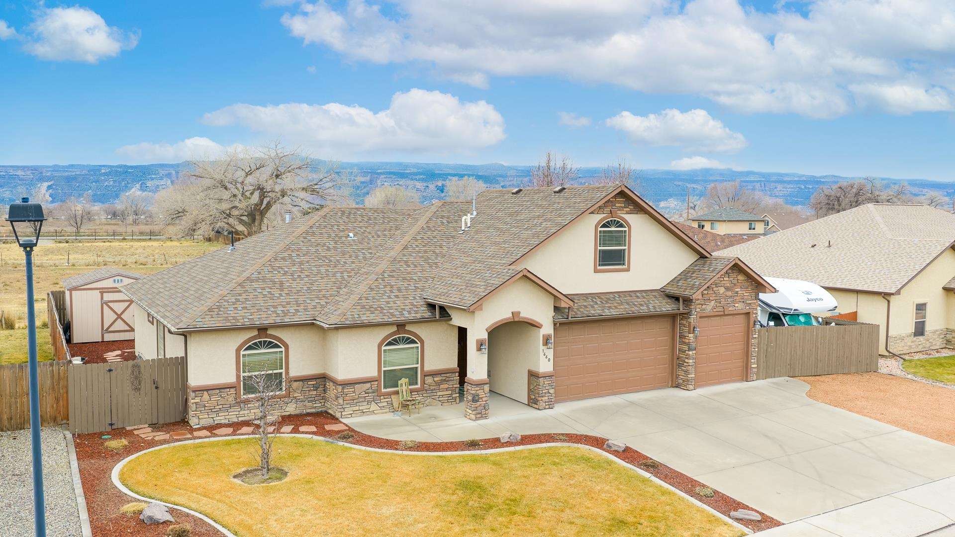 1660 Powis Lane Fruita, CO 81521 - Photo 33 of 38 a aerial view of a house with swimming pool and furniture