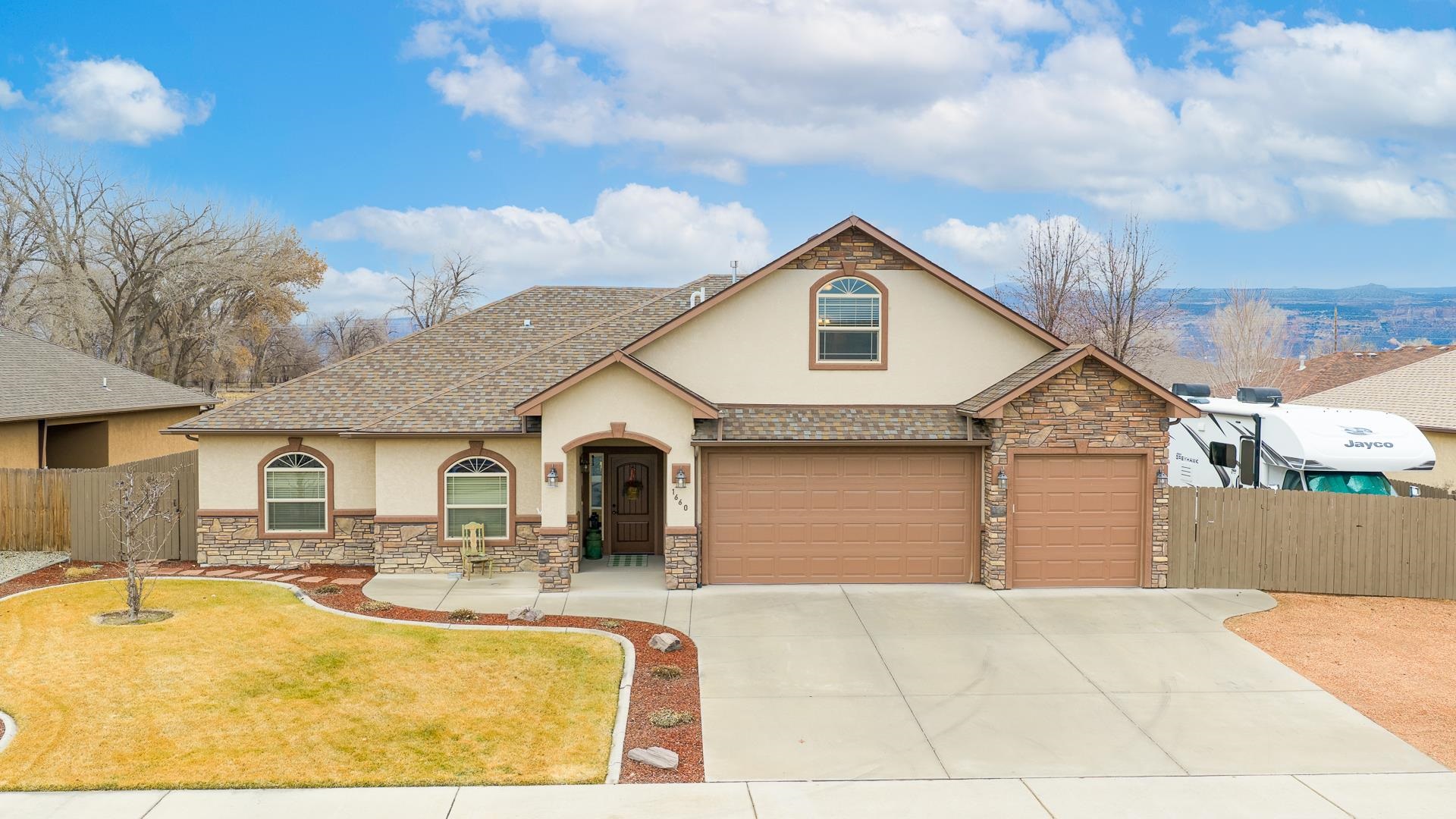 1660 Powis Lane Fruita, CO 81521 - Photo 34 of 38 a front view of a house with swimming pool and sitting space