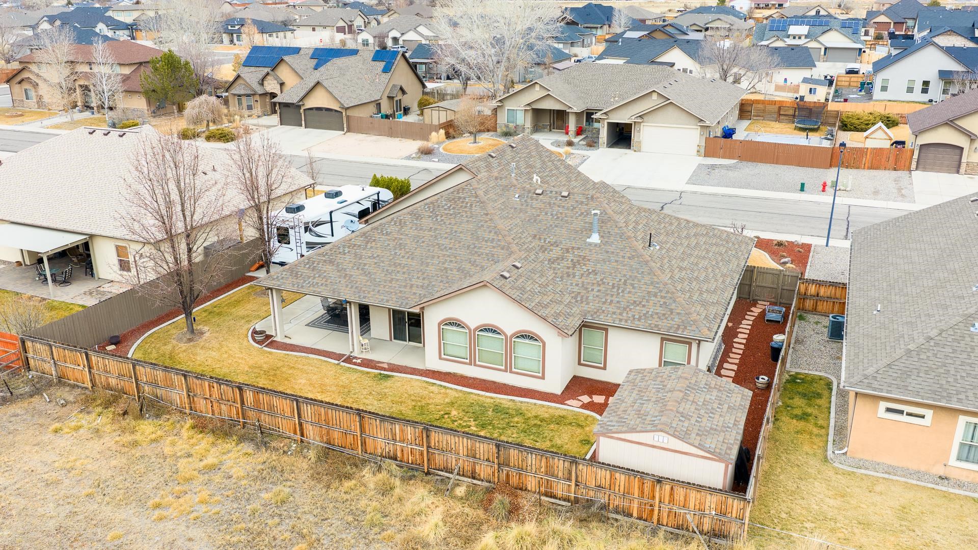 1660 Powis Lane Fruita, CO 81521 - Photo 35 of 38 an aerial view of residential houses with outdoor space and parking