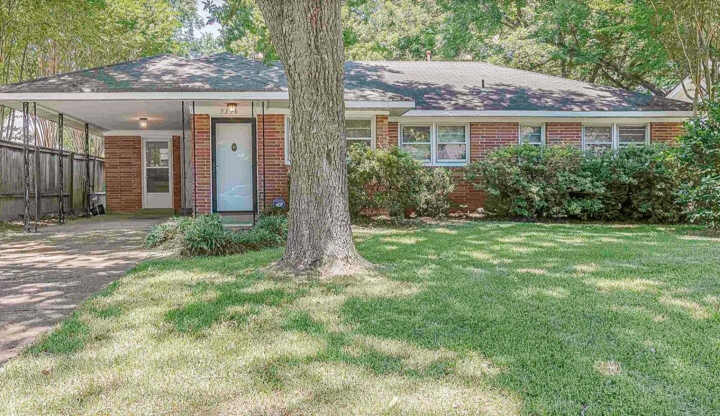 5298 Mesquite Road Memphis, TN 38120 - Photo 1 of 20 a front view of a house with a yard