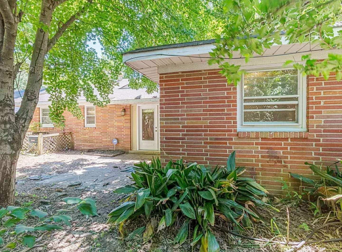 5298 Mesquite Road Memphis, TN 38120 - Photo 20 of 20 a view of a house with a yard and tree s