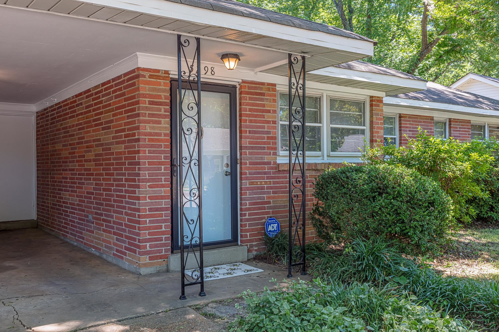 5298 Mesquite Road Memphis, TN 38120 - Photo 3 of 20 a view of a brick house with a large windows