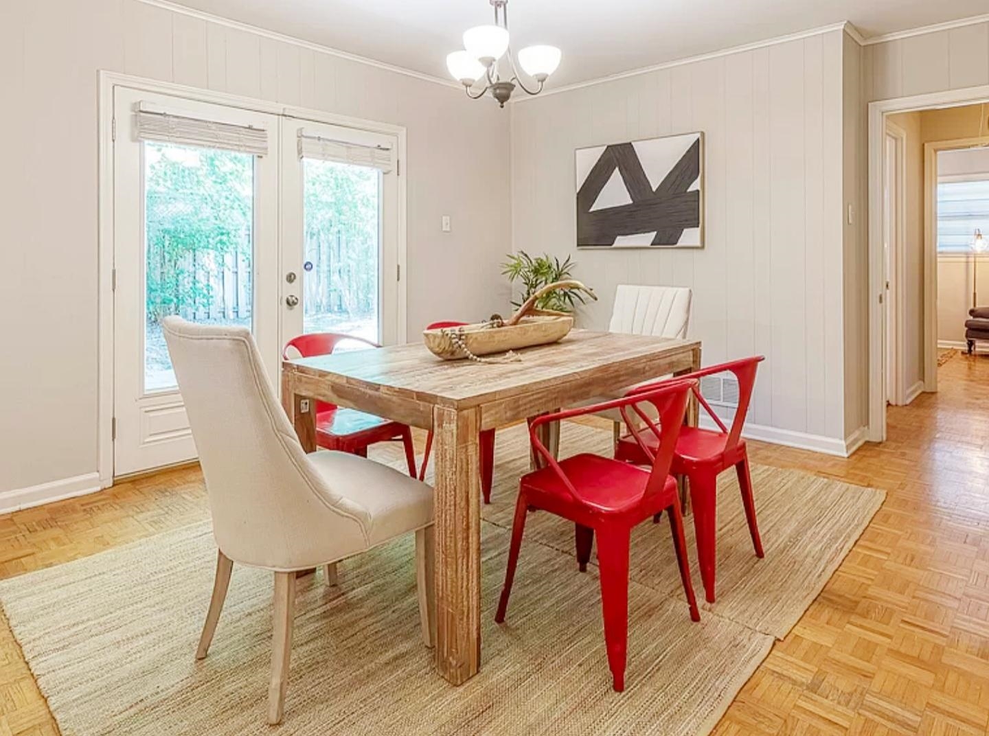 5298 Mesquite Road Memphis, TN 38120 - Photo 6 of 20 a dining room with furniture a chandelier and wooden floor