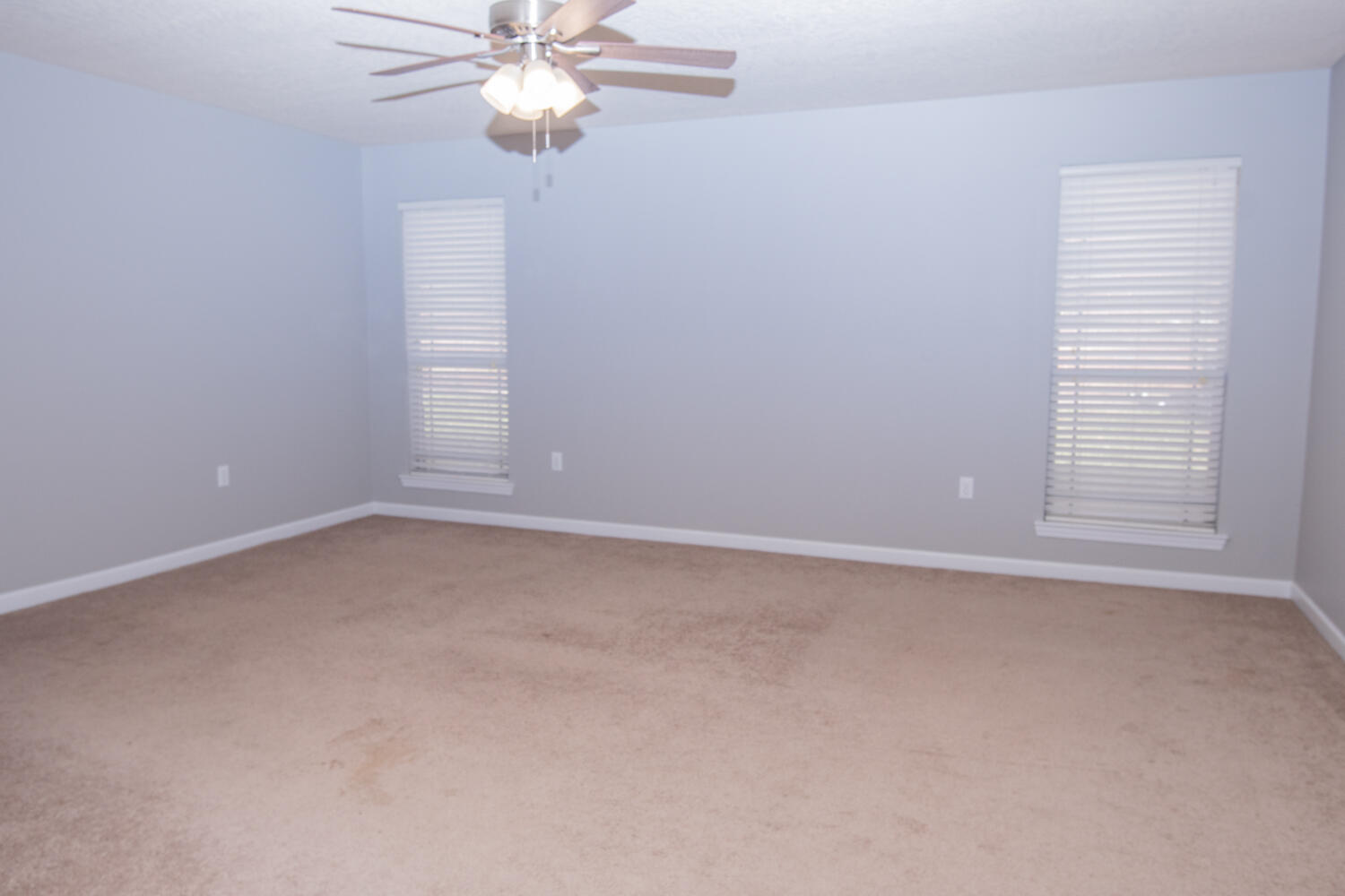 5265 Moore Loop Crestview, FL 32536 - Photo 13 of 25 an empty room with windows and fan