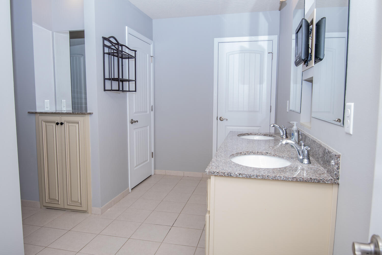 5265 Moore Loop Crestview, FL 32536 - Photo 14 of 25 a en suite bathroom with a sink and a mirror