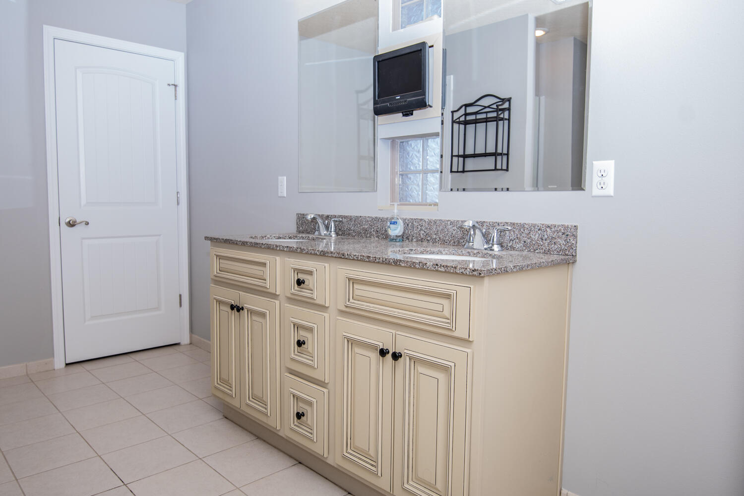 5265 Moore Loop Crestview, FL 32536 - Photo 15 of 25 a bathroom with a granite countertop sink and a mirror