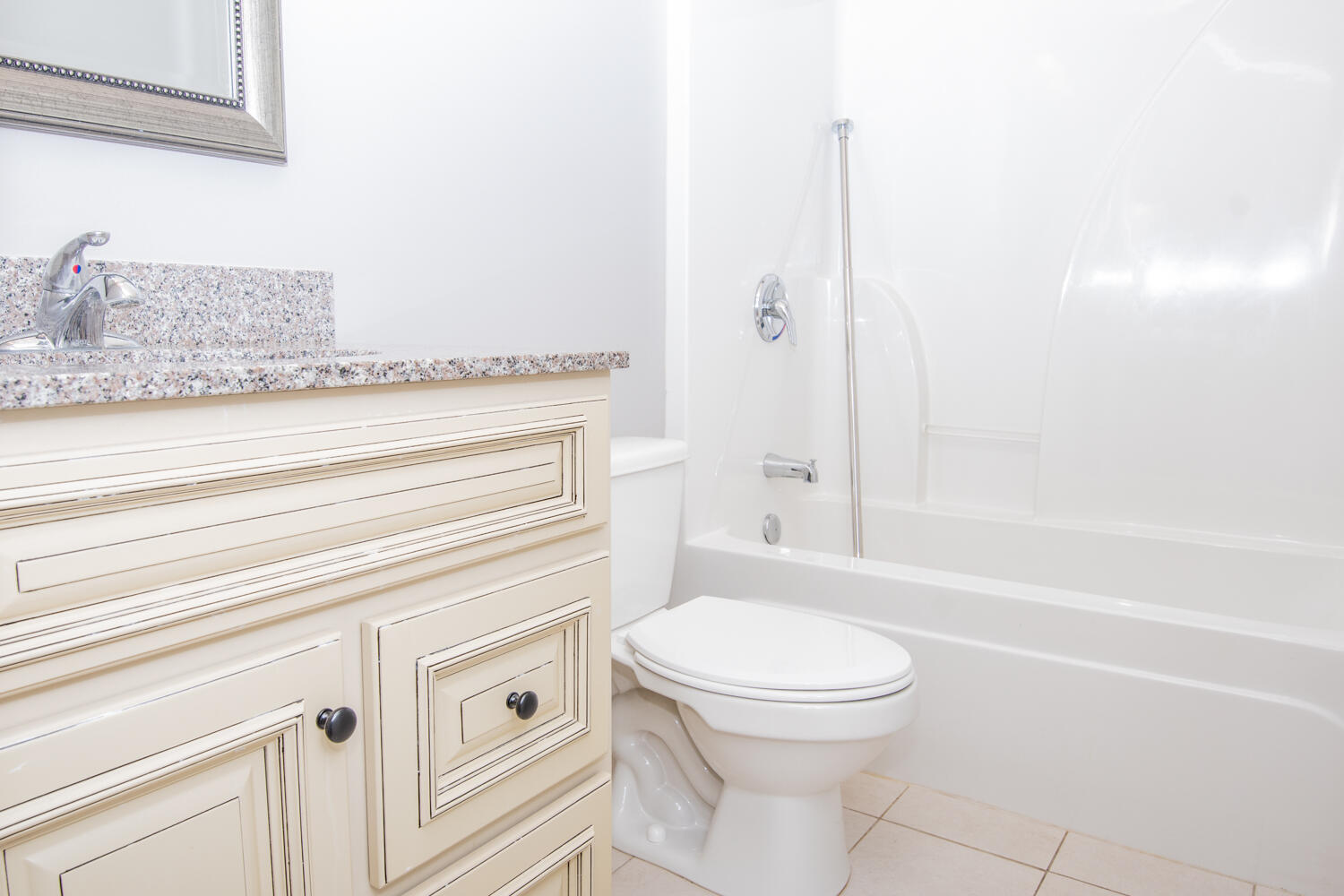 5265 Moore Loop Crestview, FL 32536 - Photo 22 of 25 a bathroom with a granite countertop sink toilet and shower