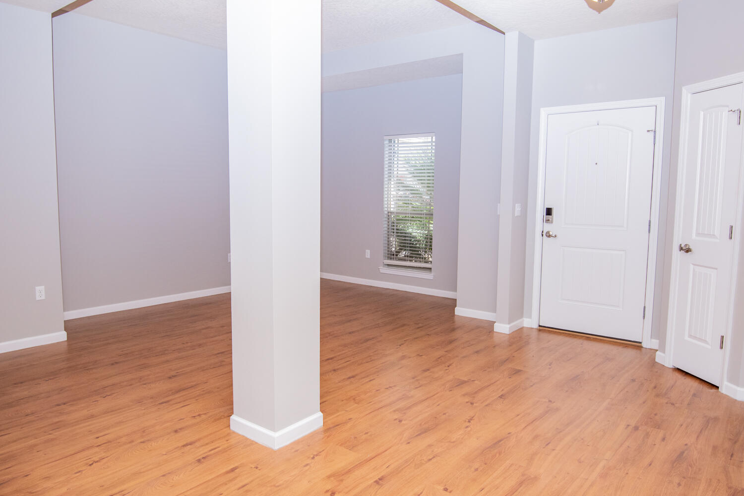 5265 Moore Loop Crestview, FL 32536 - Photo 6 of 25 a view of an empty room with wooden floor and a window