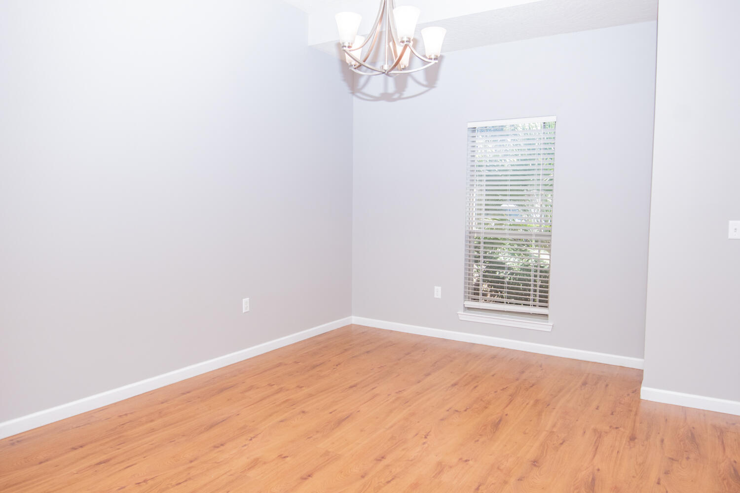5265 Moore Loop Crestview, FL 32536 - Photo 7 of 25 a view of empty room with wooden floor