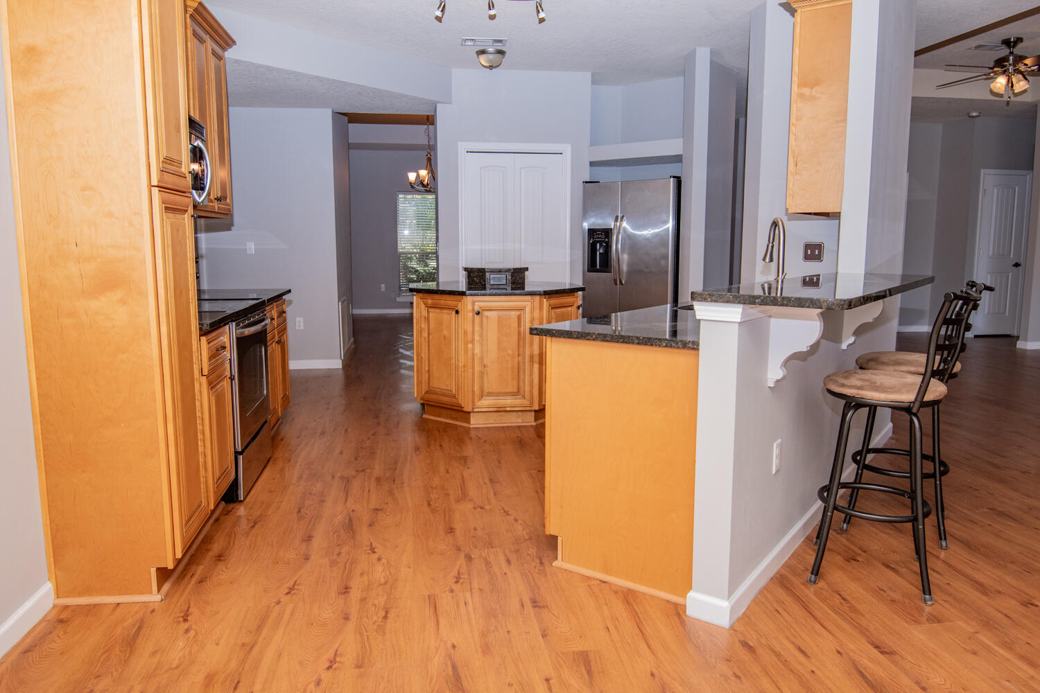 5265 Moore Loop Crestview, FL 32536 - Photo 9 of 25 a view of kitchen with furniture and wooden floor