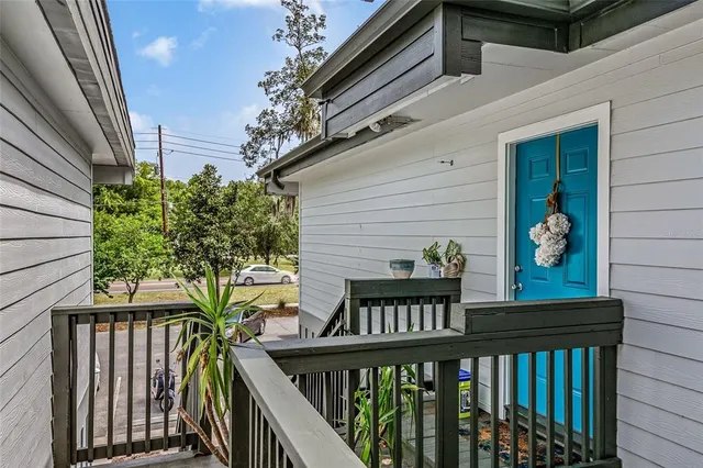 a view of a balcony with chairs