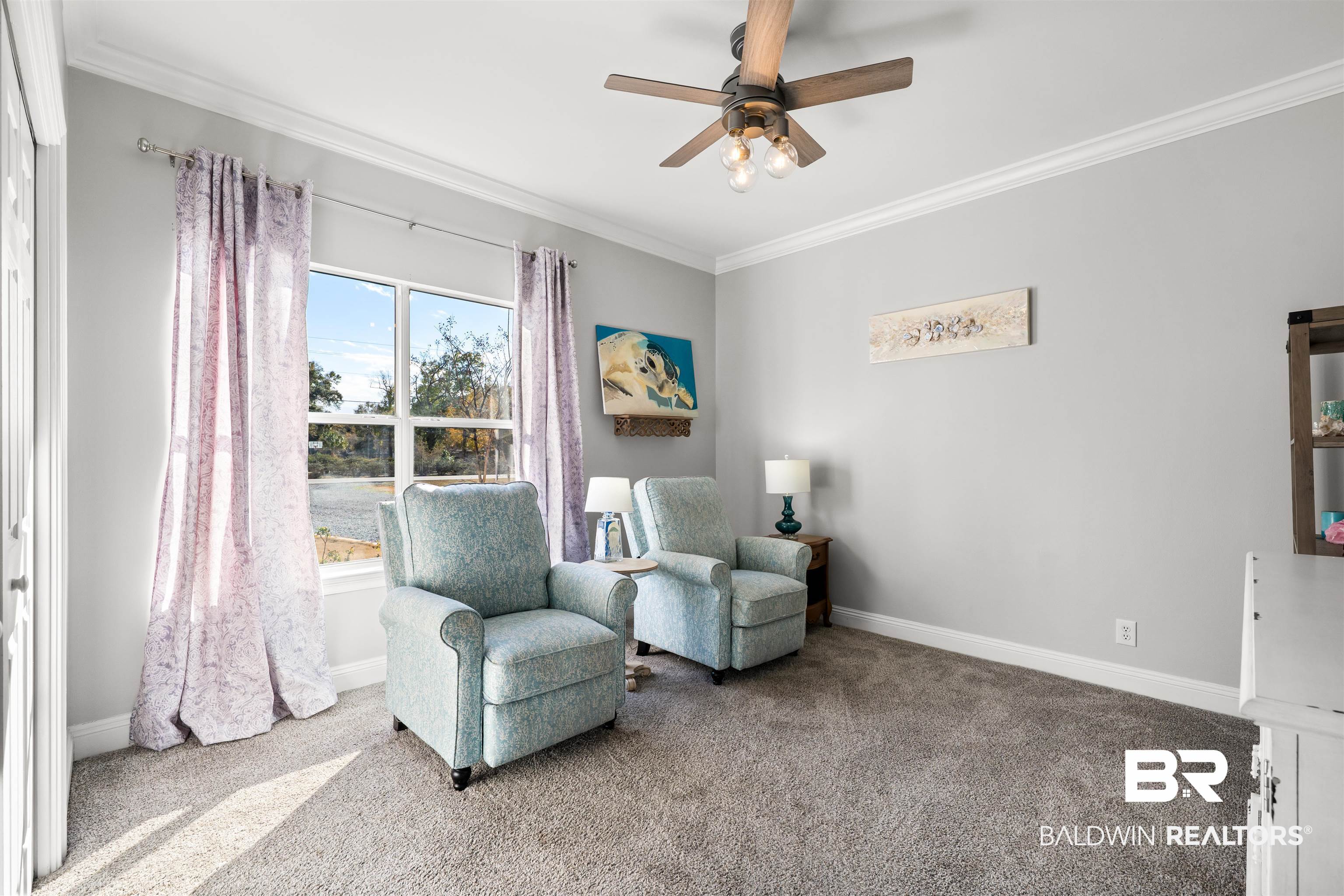 19079 Baldwin County Road 10 Foley, AL 36535 - Photo 10 of 37 Living area with carpet floors, ornamental molding, and ceiling fan
