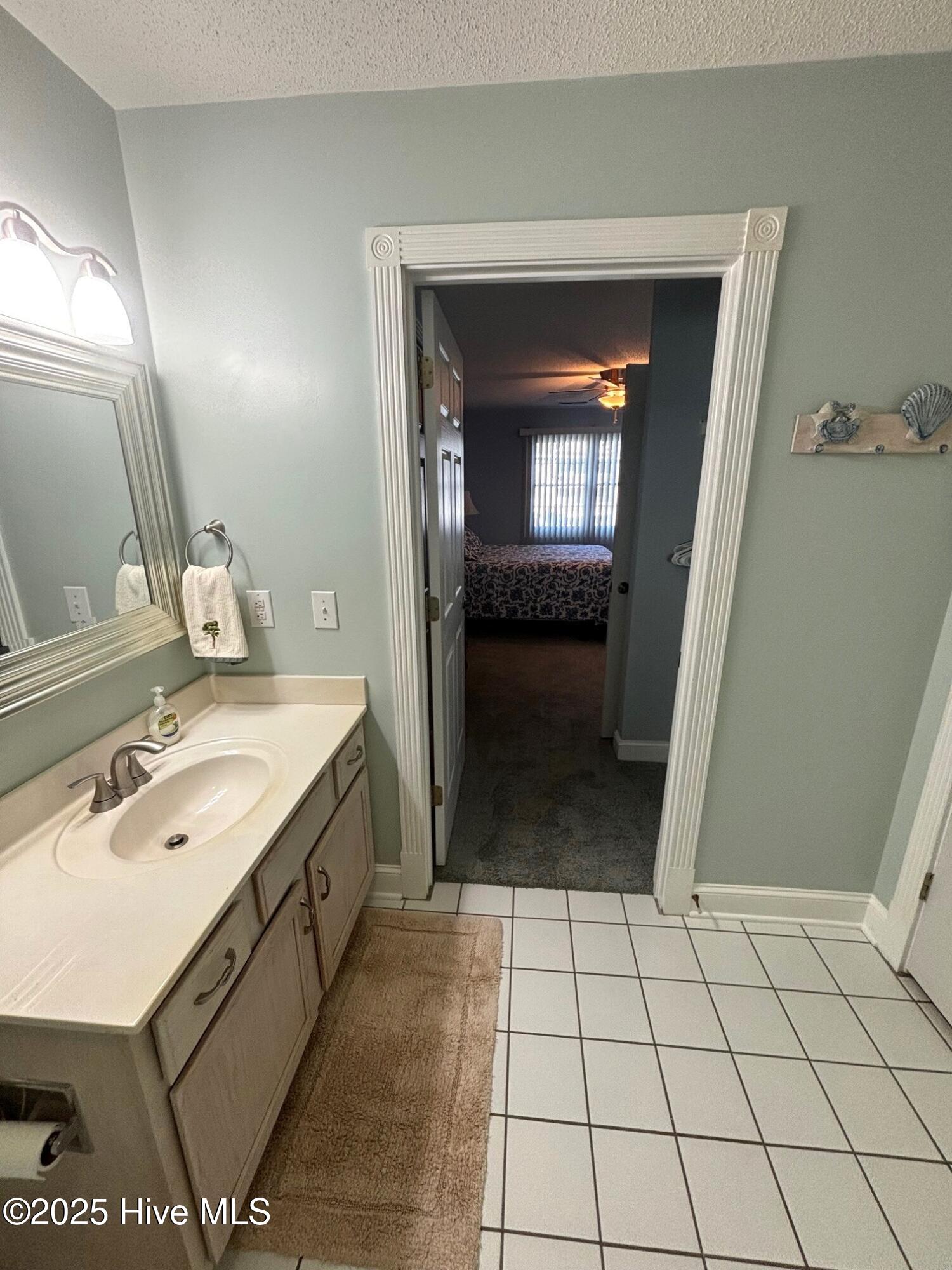 908 Resort Circle, Unit 512 Sunset Beach, NC 28468 - Photo 13 of 33 Primary Bath 2_Access to Primary Bedroom