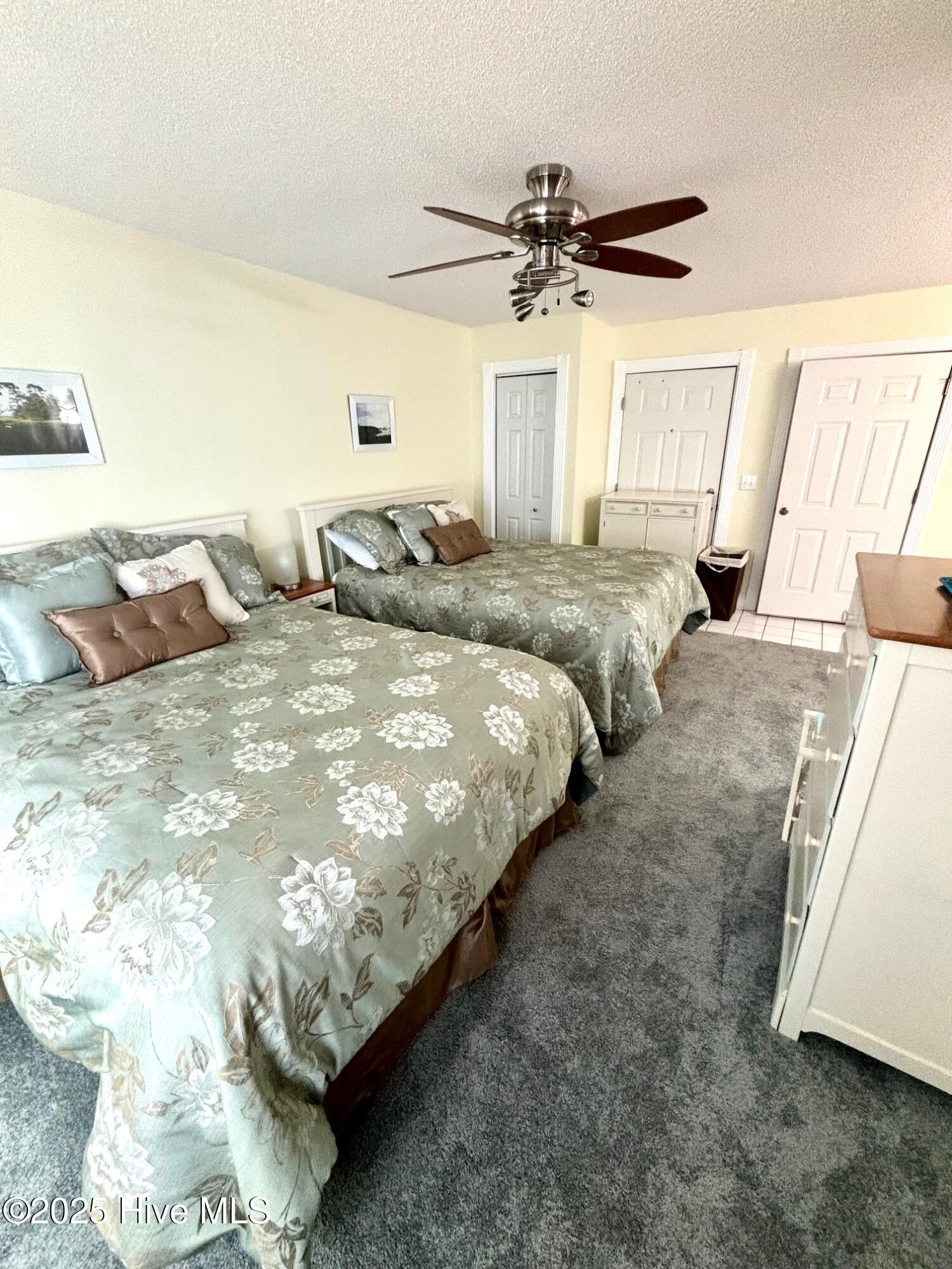 908 Resort Circle, Unit 512 Sunset Beach, NC 28468 - Photo 14 of 33 2nd Bedroom w/ 2 Queens