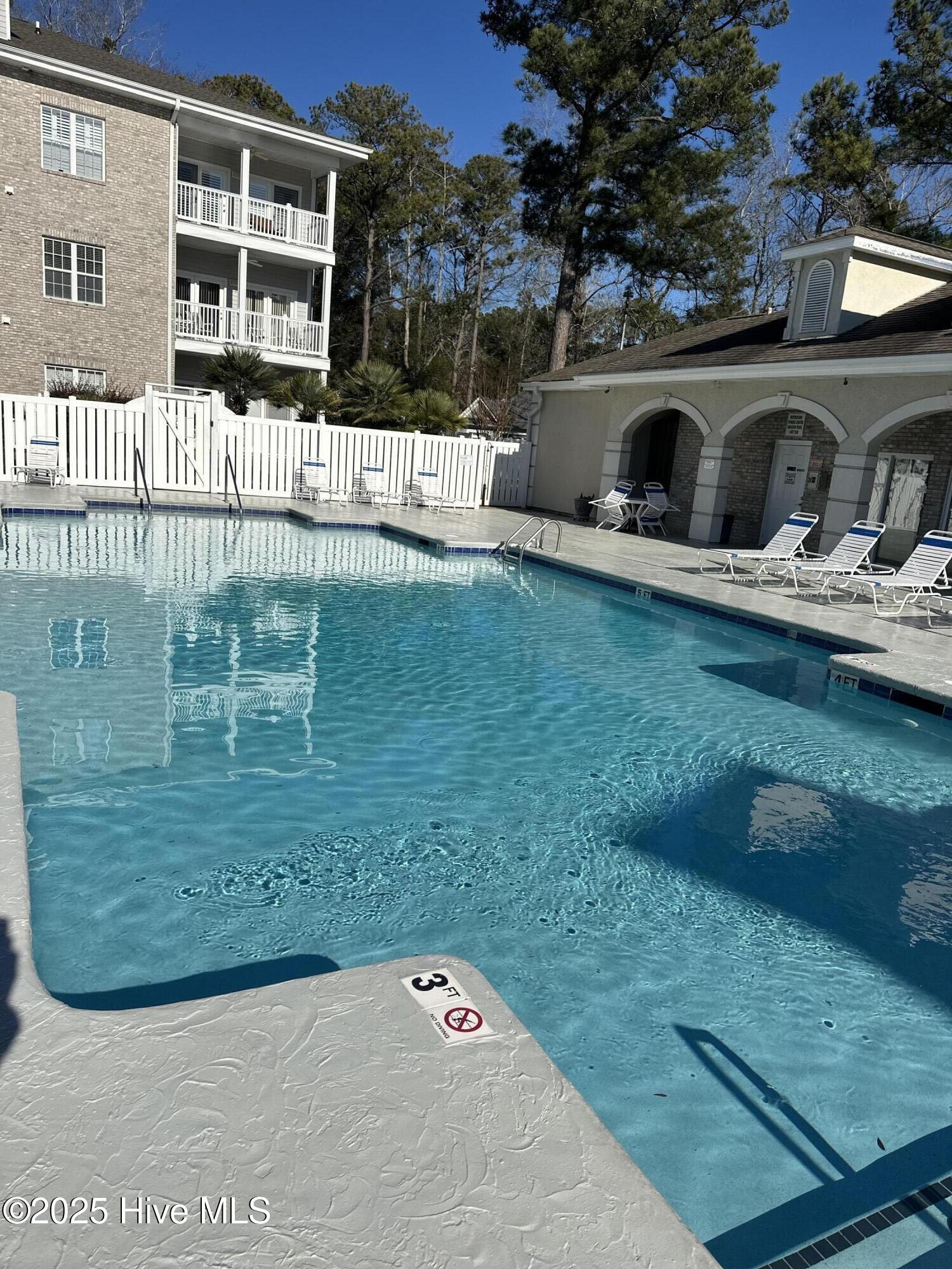 908 Resort Circle, Unit 512 Sunset Beach, NC 28468 - Photo 24 of 33 Outdoor Pool