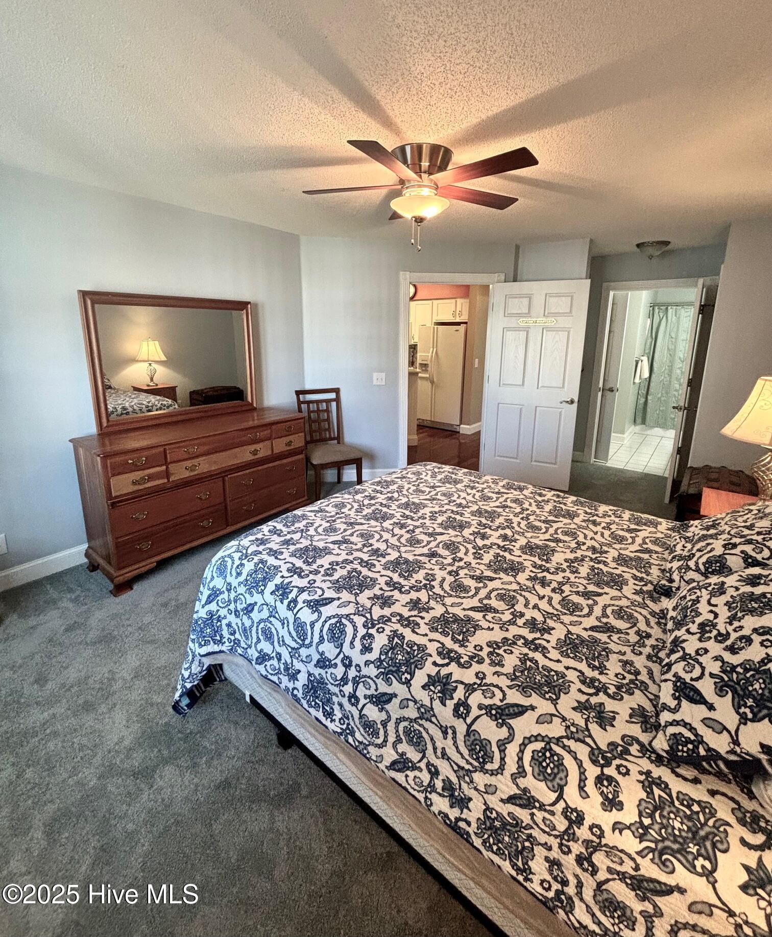 908 Resort Circle, Unit 512 Sunset Beach, NC 28468 - Photo 9 of 33 Primary Bedroom w/ Queen Bed