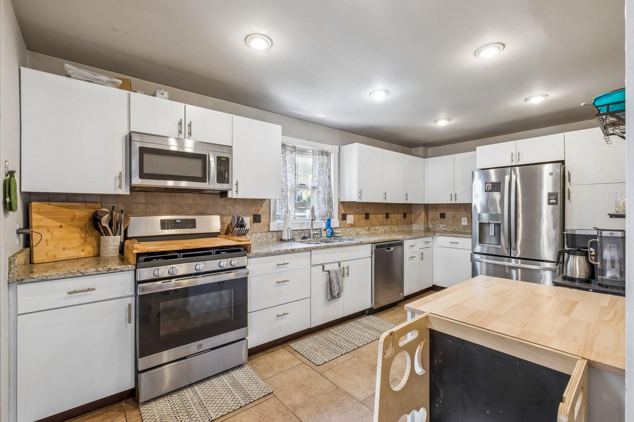 725 Hill Road Philadelphia, PA 19128 - Photo 8 of 43 a kitchen with a sink stove and refrigerator