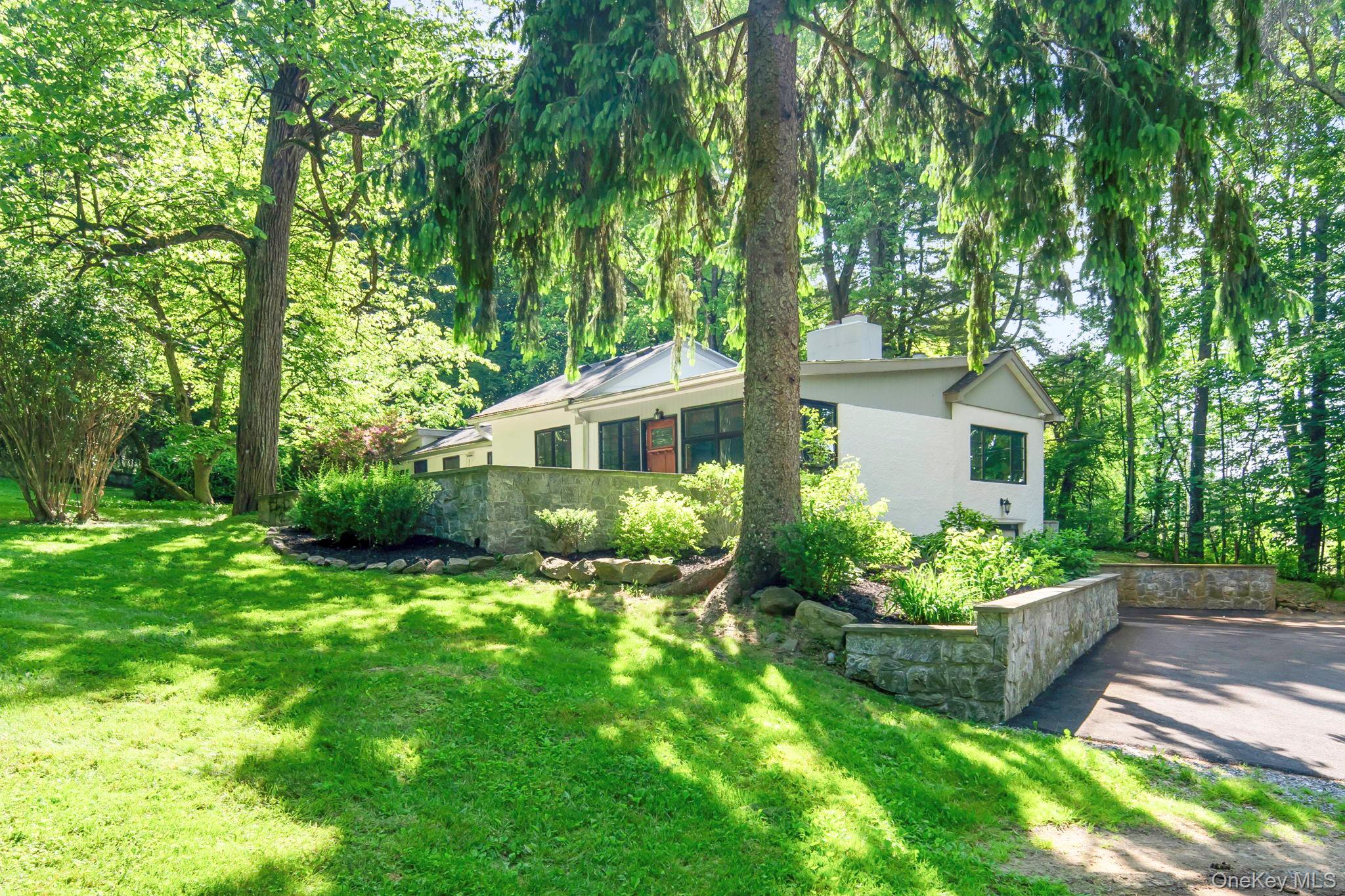 241 West Mt Airy Road Croton-on-Hudson, NY 10520 - Photo 1 of 41 a front view of a house with a yard and potted plants