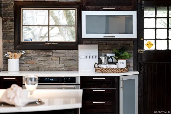 a kitchen with a stove and a microwave