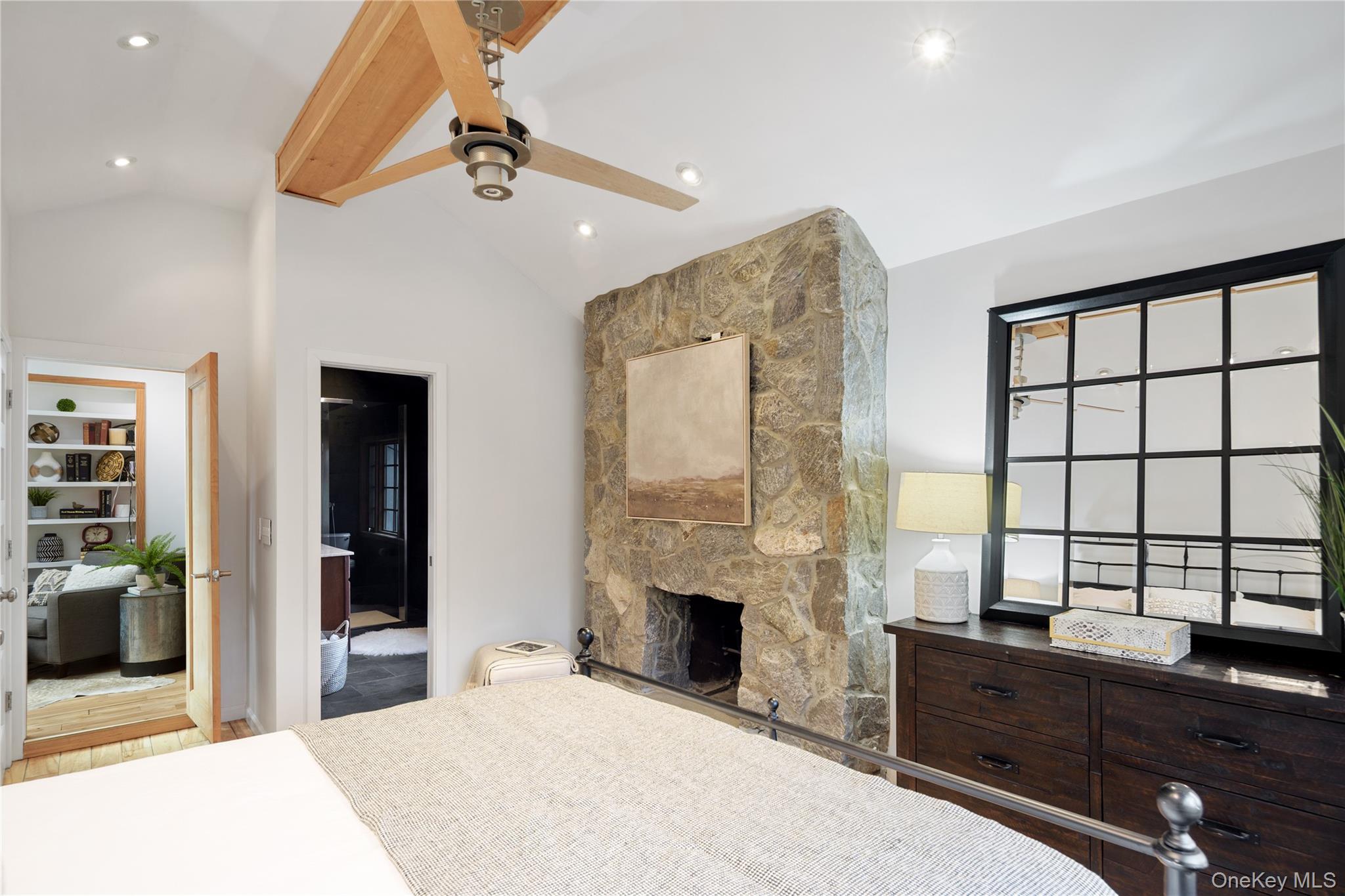 241 West Mt Airy Road Croton-on-Hudson, NY 10520 - Photo 28 of 41 a spacious bedroom with a large bed and a chandelier