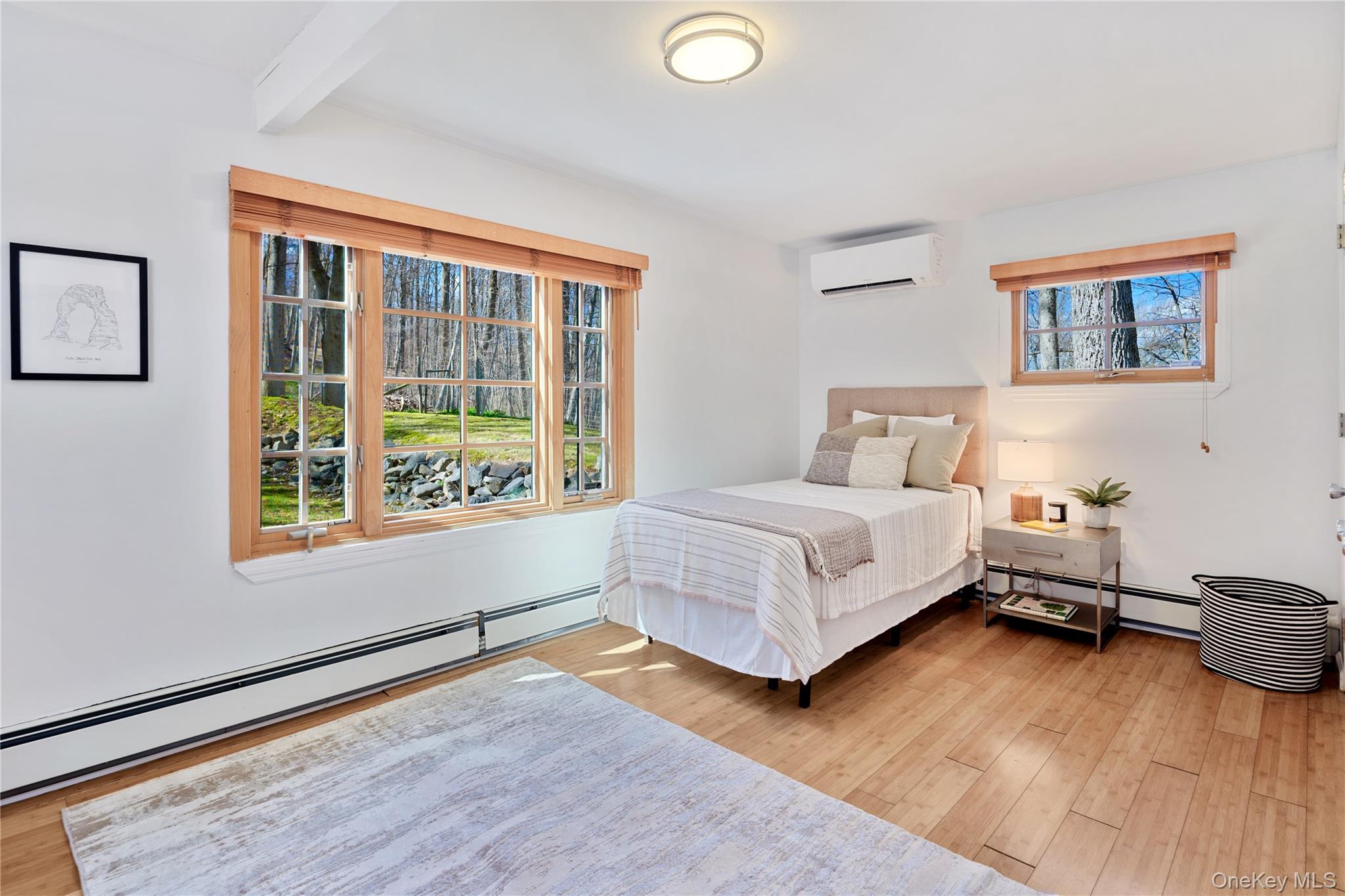 241 West Mt Airy Road Croton-on-Hudson, NY 10520 - Photo 32 of 41 a bedroom with a bed and a large window